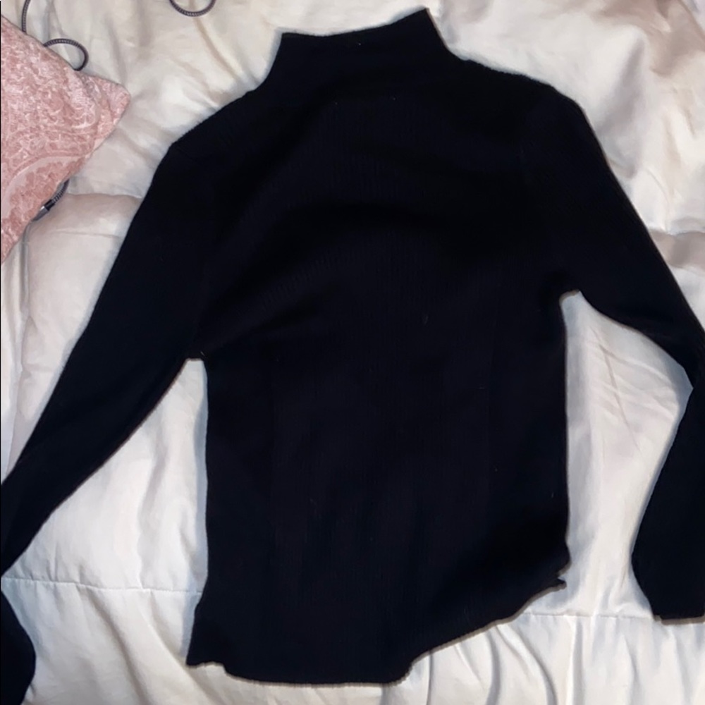 Black mock/turtle neck sweater material top.